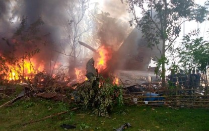 <p><strong>CRASH SITE.</strong> A Philippine Air Force C-130H Hercules transport aircraft crashes in Barangay Bangkal, Patikul, Sulu on Sunday morning (July 4, 2021). From Villamor Air Base in Pasay, the aircraft picked up personnel at Lumbia Airport in Cagayan de Oro and was on its way to Sulu when the incident happened. <em>(Photo courtesy of Bridge Bridge)</em></p>