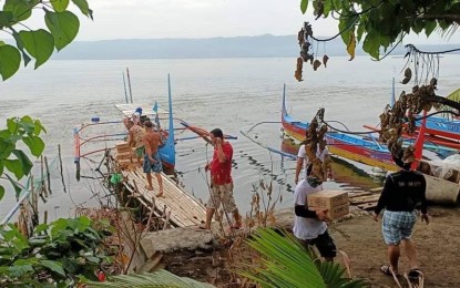 <p><strong>HELP.</strong> Relief operations are initiated by Tanauan City’s Social Welfare and Development Office for residents of Sitio Mahabang-Buhangin on Saturday (July 3, 2021). A medical team also gives free consultations to those experiencing respiratory ailments due to the effects of volcanic smog.<em> (Photo courtesy of OCD Facebook)</em></p>