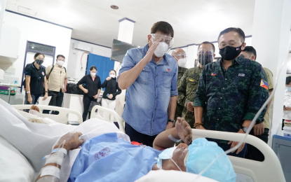 <p><strong>SALUTE FOR SACRIFICES.</strong> President Rodrigo R. Duterte salutes a wounded soldier who survived during the C-130 crash in Sulu following the conferment of the Order of Lapu-Lapu with the Rank of Kampilan at the Camp Navarro General Hospital, Western Mindanao Command in Zamboanga City on Monday (July 5, 2021). Duterte assured families of 49 soldiers killed in the plane crash that their sacrifices will not go in vain. <em>(Presidential photo by King Rodriguez)</em></p>