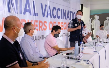 <p><strong>CEREMONIAL VACCINATION.</strong> Health Secretary Francisco Duque III (standing) delivers his message during the ceremonial vaccination rollout for A4 workers at the Clark Freeport Zone in Pampanga on Tuesday (July 6, 2021). The activity is a joint effort of the Department of Health, Inter-Agency Task Force for the Management of Emerging Infectious Diseases, Luen Thai International Group Philippines, the provincial government of Pampanga, Clark Development Corporation, and the Mabalacat City government.<em> (Photo courtesy of the city government of Mabalacat)</em></p>