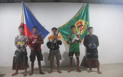 <p><strong>BACK TO THE FOLD OF LAW.</strong> Five regular New People's Army rebels yield to government troops in Aroroy, Masbate on Tuesday (July 6, 2021). They turned over to the authorities one high-powered and two low-powered firearms as well as six anti-personnel mines. <em>(Photo courtesy of 9ID)</em></p>