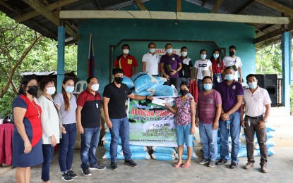 <p><strong>SUPPORT TO HOG RAISERS.</strong> Prosperidad, Agusan del Sur Mayor Frederick Mark Plaza Mellana (5th from left) hands over a total of PHP316,000 financial aid to 68 hog raisers who are affected by African swine fever in the area in a ceremony on Wednesday (July 7, 2021). The local government said it is working with the concerned agencies of the government to contain the spread of the disease and address its effects on the hog raisers in the area. <em>(Photo courtesy of Team Prosperidad Facebook Page)</em></p>