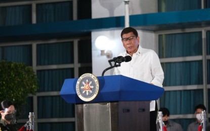 <p><strong>HEARTFELT GRATITUDE.</strong> President Rodrigo Duterte expresses his heartfelt gratitude to the Japanese government for its donation of 1.124 million doses of AstraZeneca vaccine during the turnover rites at the Villamor Air Base in Pasay City on Thursday night (July 8, 2021). Duterte said the Philippines and Japan’s cooperation in fighting the Covid-19 pandemic indicates the two countries’ “deep friendship.” <em>(Photo courtesy of NTF)</em></p>