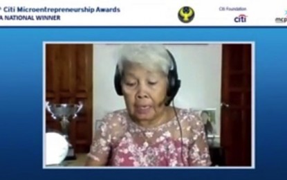 <p><strong>MICROENTREPRENEUR OF THE YEAR</strong>. Luzviminda "Nanay Luz" Sunit joins the virtual awarding rites for the 18th Citi Microentrepreneurship Award on June 15, 2021. On Thursday (July 8, 2021), City Savings Bank said Sunit, a dried fish vendor in Medellin, Cebu, has been hailed as microentrepreneur of the year national awardee.<em> (Screengrab from video courtesy of City Savings Bank)</em></p>