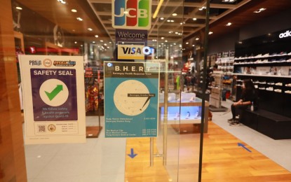 <p><strong>CERTIFIED.</strong> A shoe store in a Pasig City mall secures a Safety Seal in this undated photo. The seal is issued by local government units to establishments that strictly comply with health guidelines and policies. <em>(Photo courtesy of Pasig-PIO)</em></p>