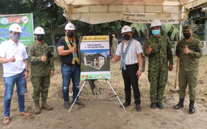 <p><strong>SHELTER FOR FRs</strong>. The provincial government of Negros Oriental, with other government agencies under the Enhanced Comprehensive Livelihood Integration Program, is building a halfway house for former rebels of the New People's Army. On Monday (July 5, 2021) Gov. Roel Degamo (left side of the poster) and DILG 7 Regional Director Leocadio Trovela (right) led the groundbreaking and dedication ceremony at Camp Leon Kilat in Tanjay City, Negros Oriental. <em>(Photo courtesy of the Philippine Army)</em></p>