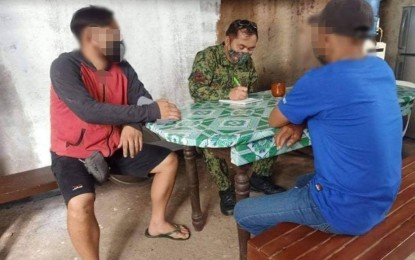 <p><strong>SURRENDER</strong>. Two supporters of the Communist Party of the Philippines-New People’s Army (CPP-NPA) have surrendered to authorities in Dumarao, Capiz on July 7, 2021. They will be validated and recommended to avail of benefits under the Enhanced Comprehensive Local Interrogation Program.<em> (Photo courtesy of Capiz Police Provincial Office)</em></p>