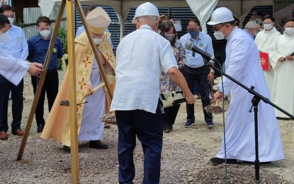 <p><strong>RISING SOON.</strong> Manila Archbishop Jose Cardinal Advincula (left, in gold vestment) leads the groundbreaking of Sto. Niño Parish in Pandacan, Manila on Saturday (July 10, 2021). The church was gutted by a fire last year. <em>(Photo from Sto Niño Parish Pandacan Facebook page)</em></p>