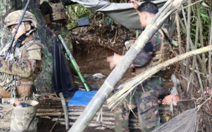 <p><strong>FALLEN ENCAMPMENT.</strong> Troops of the 5th Scout Ranger Battalion inspect the encampment of the Abu Sayyaf Group (ASG) bandits they seized following a 20-minute clash in Bud Daho, Barangay Lumping Pigi Daho, Talipao, Sulu on Friday (July 9, 2021). An ASG member was killed during the clash. <em>(Photo courtesy of the 11th Infantry Division Public Affairs Office)</em></p>