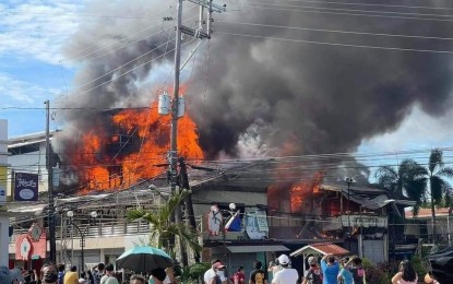 <p><strong>UP IN SMOKE.</strong> Fire of still unknown origin razed a commercial building in Abucay, Bataan on Sunday morning (July 11, 2021). No one was hurt in the incident that reached the second alarm. <em>(Contributed photo)</em></p>