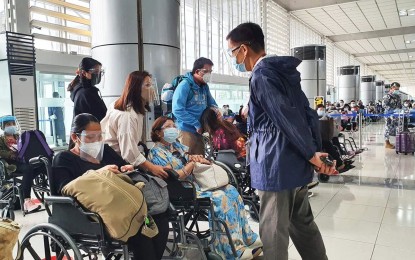 <p><strong>REPATRIATES.</strong> The Department of Labor and Employment and the Overseas Workers Welfare Administration, in coordination with the Philippine Consulate General in Dubai, repatriate 348 overseas Filipino workers from the United Arab Emirates on Saturday (July 11, 2021). Four more repatriation flights are expected on July 12, 17, 27, and 30. <em>(Photo courtesy of OWWA)</em></p>
