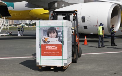 <p><strong>MORE LIFE-SAVING JABS.</strong> The Cebu Pacific flight 5J 671 carrying government-procured one million doses of the Sinovac vaccine lands at the Bay 116 ramp of the Ninoy Aquino International Airport Terminal 3 in Pasay City on Wednesday (July 14, 2021). The Philippines has so far received 13 million Sinovac doses, both donated and government-procured. <em>(PNA photo by Joey Razon)</em></p>