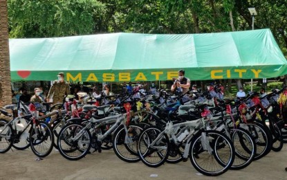 <p><strong>COMMEMORATION. </strong>Thirty-nine bicycles were distributed to the youth by the Philippine Army at the Ninoy Aquino Freedom Park in Masbate City on Wednesday (July 14, 2021). The event was held to commemorate the 40th day of the passing of Kieth Absalon, and his cousin, Nolven, who were killed by anti-personnel mines planted by the New People’s Army on June 6. <em>(Photo courtesy of 9ID)</em></p>