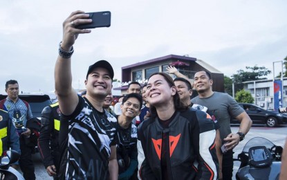 <p><strong>FRIENDS.</strong> House Speaker Lord Allan Velasco and Davao City Mayor Sara Duterte take a selfie before hitting the road in a 300-kilometer motorcycle ride in November 2019. The event from San Pedro, Laguna to Marinduque was for the benefit of earthquake victims in Mindanao. <em>(Photo courtesy of Rep. Velasco)</em></p>
