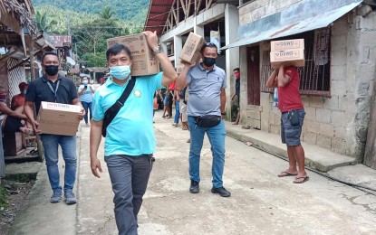 <p><strong>ATTAINING PEACE</strong>. Matuguinao, Samar Mayor Aran Boller (center) leads the delivery of food packs to families in one of the rebel-cleared villages in their town on June 18, 2021. The town is giving more attention to 12 villages recently rid of the influence of the New People’s Army. <em>(Photo courtesy of Matuguinao local government)</em></p>