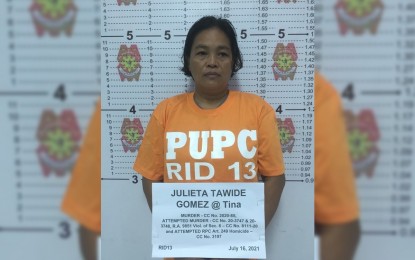 <p><strong>ARRESTED.</strong> Joint Army and police operatives arrest in a law enforcement operation in Quezon City on Friday (July 16, 2021) two top CPP-NPA leaders in Caraga, identified as Julieta Gomez, alias Tina (in photo), secretary of the Regional Urban Committee of the North Eastern Mindanao Regional Committee; and Niezel Velasco, regional liaison of NEMRC. The two were arrested under arrest warrants for murder and frustrated murder issued by local courts in Caraga. <em>(Photo courtesy of 4ID Information Office)</em></p>
