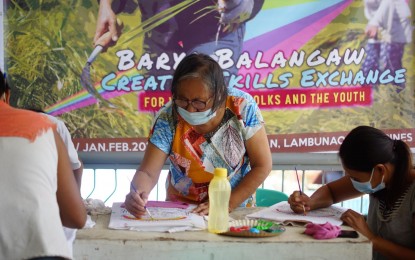 <p><strong>SWAPPING FARM TOOLS WITH BRUSHES</strong>. Selected women from Barangay Caninguan, Lambunao, Iloilo try their hands on painting. Raz Salvarita (not in photo), co-founder of the Baryo Balangaw Creative Initiatives that introduced the project, said in an interview on Friday (July 16, 2021) that they were able to inspire women to pursue creative works while engaging in other livelihood activities. <em>(Photo courtesy of Raz Salvarita/Baryo Balangaw Creative Initiatives)</em></p>