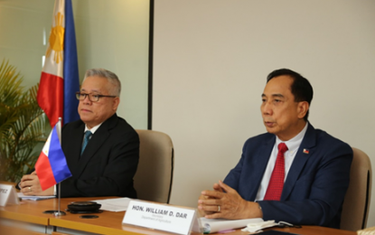 <p><strong>WTO MEET</strong>. Trade Secretary Ramon Lopez (left) and Agriculture Secretary William Dar (right) attend the World Trade Organization virtual Trade Negotiations Committee Ministerial-level Meeting on Fisheries Subsidies on July 15, 2021. The officials affirm the country's support to the WTO to conclude talks on fisheries subsidies this year. <em>(Photo courtesy of DTI)</em></p>