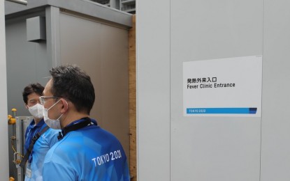 <p>Tokyo 2020 staff on duty at the fever clinic entrance in the Olympic Village, June 20, 2021.<em> (Xinhua/Wang Zijiang)</em></p>