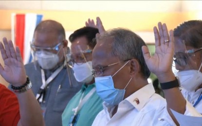 <p><strong>NEW PREXY.</strong> Energy Secretary Alfonso Cusi (front) is elected new Partido Demokratiko Pilipino-Lakas ng Bayan president during the party national assembly in Clark, Pampanga on Saturday (July 17, 2021). He replaced Senator Manny Pacquiao who is currently training in California for his August 22 (August 21, US time) fight against Errol Spence Jr. in Las Vegas. <em>(Screengrab)</em></p>