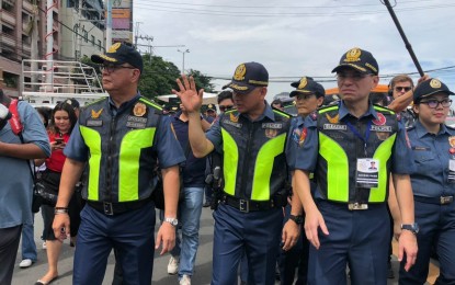 <p><strong>SECURITY.</strong> Gen. Guillermo Eleazar (right), then the National Capital Region Police director, leads the security force during the 2019 State of the Nation Address. The Philippine National Police chief said about 15,000 cops will be deployed on July 26, 2021 when President Rodrigo Duterte delivers his final SONA. <em>(PNA file photo)</em></p>