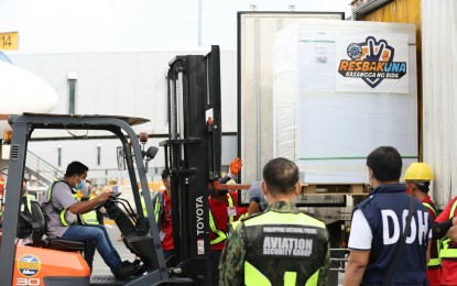 <p><strong>MORE DOSES.</strong> A total of 1.5 million doses of the Sinovac Covid-19 vaccine arrive at the Ninoy Aquino International Airport Terminal 3 on Saturday (July 17, 2021). They will be distributed nationwide to be administered as second doses. <em>(PNA Photo by Robert Alfiler)</em></p>