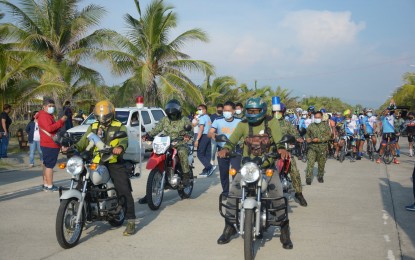 <p><strong>ANTI-REDS.</strong> Members of the Pangasinan Police Provincial Office and the Army’s 702nd Infantry Defender Brigade lead participants of the 'Bike for Justice and Peace' in Lingayen on Saturday (July 17, 2021). The nationwide event condemned communist terrorist groups and called for justice for their victims. <em>(Photo courtesy of Pangasinan PDRRMO)</em></p>
