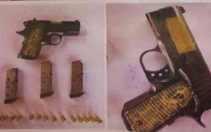 <p><br /><strong>SEIZED</strong>. The gun confiscated during a Comelec hearing on voters registration in Datu Blah Sinsuat, Maguindanao on Monday (July 19, 2021). The gun, a compact .45-caliber pistol, was discovered after it fell off from the waist of one of two parties involved in the minor commotion that occurred during the voters registration at the municipal hall. <em>(Photo courtesy of DBS MPS)</em></p>