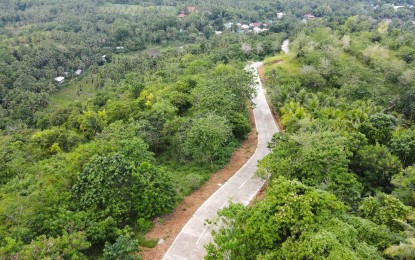 <p><strong>TOURISM ROAD</strong>. A newly completed road leading to Fatima Hills, a tourism site in Macrohon, Southern Leyte in this undated photo. At least 1,380 kilometers of roads and 570 bridges in Eastern Visayas have been built and upgraded in the past five years through the national government’s “Build, Build, Build” program. <em>(Photo courtesy of Department of Public Works and Highways-Region 8)</em></p>