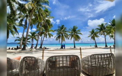 <p><strong>TOP TOURIST DESTINATION.</strong> A view of the scenic Boracay Island beachfront in Malay, Aklan in this undated photo. The Russian-Asian Union of Industrialists and Entrepreneurs has named the Philippines as the Tourism Destination of the Year in a ceremony held in Moscow on Dec. 15, 2023. <em>(PNA file photo)</em></p>