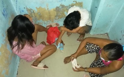 <p><strong>BUSTED.</strong> Three females are in detention at Police Station 2 in Barangay Cogon, Cagayan de Oro City after they were arrested with illegal drugs on Saturday (July 24, 2021). The city is under enhanced community quarantine but it did not stop the suspects from plying their trade.<em> (Contributed photo)</em></p>