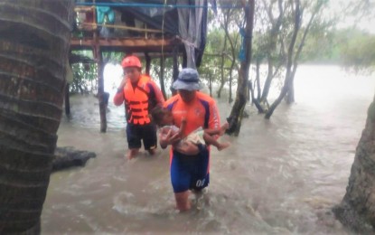 <p><strong>RESCUE.</strong> The Philippine Coast Guard leads rescue operations in Tanza and Kawit, Cavite on Saturday (July 24, 2021). The southwest monsoon, enhanced by Typhoon Fabian which has already left the country, continues to bring moderate to heavy rains. <em>(Photo courtesy of NDRRMC)</em></p>