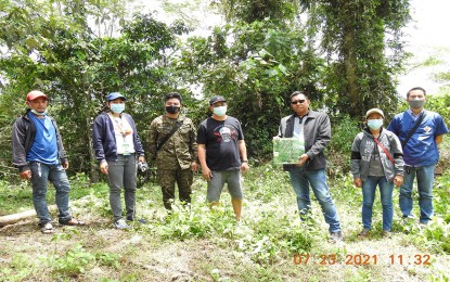 <p><strong>BACK IN THE WILD</strong>. Marslou D. Bonita (third from right), head of the DENR-CENRO in Cantilan, Surigao del Sur, leads the release of a Philippine tarsier back to its natural habitat in Barangay Hinapoyan, Carmen town on July 23, 2021. Another tarsier was also rescued and released in the province on July 21 in Barangay Adlay, Carrascal. <em>(Photo from DENR-CENRO Cantilan's Facebook page)</em></p>