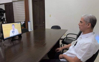 <p><strong>SONA WATCH</strong>. Negros Occidental Governor Eugenio Jose Lacson virtually attends the sixth and final State of the Nation Address of President Rodrigo Duterte from the Provincial Capitol in Bacolod City on Monday (July 26, 2021). Amid the Covid-19 crisis, Lacson said Duterte’s call for rebound and recovery programs as well as retooling and upscaling of workers for better job opportunities is “decisively pivotal”. <em>(Photo courtesy of PIO Negros Occidental)</em></p>