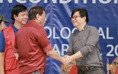 <p><strong>INFRA BOOST</strong>. File photo shows Presidential Assistant for the Visayas Secretary Michael Lloyd Dino shaking hands with President Rodrigo Duterte. Dino on Tuesday (July 27, 2021) lauded the Chief Executive for the "golden age of infrastructure" ushered in by the Duterte administration, which greatly benefited the three regions in the Visayas. <em>(File photo courtesy of OPAV)</em></p>