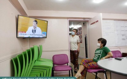 <p><strong>MONITORING.</strong> Davao City Mayor Sara Z. Duterte stands by the door as she watches her father President Rodrigo Duterte delivers her final State of the Nation Address (SONA) on Monday (July 26, 2021). The presidential daughter did not attend the event and only watched it on television. <em>(Photo courtesy of Mayor Inday Sara Duterte Facebook Page)</em></p>