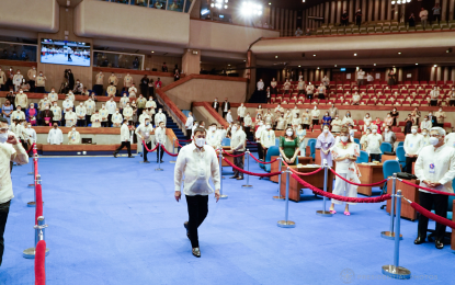 <p><strong>NO PROBLEM</strong>. President Rodrigo Roa Duterte enters the plenary hall of the House of Representatives at the Batasang Pambansa in Quezon City to deliver his sixth and final State of the Nation Address on Monday (July 26, 2021). Malacañang said on Tuesday public need not worry about Duterte’s health after the President, in a video clip during SONA, appeared to lose his balance.<em> (Presidential photo)</em></p>