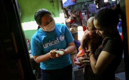 <p><strong>UNICEF IN ACTION.</strong> A staff of UNICEF Philippines visits a family in this undated photo. Google has allocated USD300,000 (PHP15 million) to UNICEF in the Philippines and some USD5 million worth of Ad Grants to local government agencies and organizations in Southeast Asia, including the Philippines, for Covid-19 response. <em>(Photo from Google Philippines)</em></p>