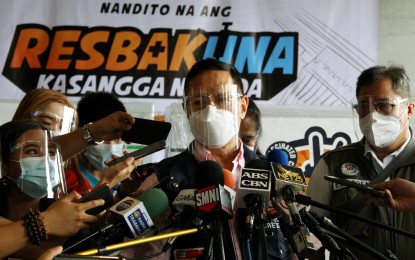 <p><strong>RESPONSE INTACT.</strong> DOH Secretary Francisco Duque III answers questions from reporters on the sidelines of the arrival of one million doses of government-procured Sinovac vaccines from China at the NAIA Terminal 3 on Friday (July 30, 2021). He said there is no community transmission yet of the highly transmissible Covid-19 Delta variant in the country. <em>(PNA photo by Jess Escaros)</em></p>