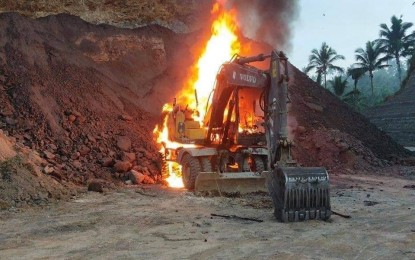 <p><strong>DAMAGED.</strong> This photo released by the Northern Samar Police Provincial Office shows one of 10 heavy equipment torched by New People’s Army rebels in Las Navas town on Thursday (July 29, 2021). The incident will cause delay in the construction of a new highway that will connect the towns of Jipapad in Eastern Samar and Las Navas.<em> (Photo courtesy of NSPPO)</em></p>