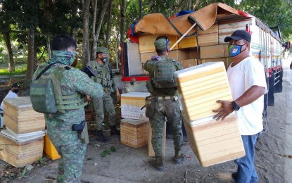 <p><strong>SMUGGLED CIGARETTES. </strong>Troops of the 74th Infantry Battalion (74IB), intercept a cargo truck loaded with some PHP4.3 million worth of smuggled cigarettes concealed behind styrofoam coolers in Sitio Malasugat, Barangay Sangali, Zamboanga City on Friday (July 30, 2021). Another PHP450,000 worth of cigarettes was also seized by authorities at a checkpoint in Pagadian City, Zamboanga del Sur early Saturday.<em> (Photo courtesy of 74IB)</em></p>