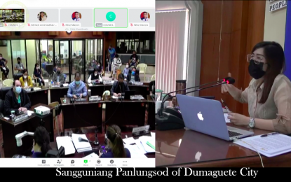 <p><strong>COUNCIL SESSION</strong>. Dumaguete City Vice Mayor Karissa Tolentino-Maxino (right) presides the July 28, 2021 regular session of the Sangguniang Panlungsod. The body has postponed a special session set for Monday (Aug. 2, 2021), after a councilor tested positive for Covid-19.<em> (Screengrab from the Facebook livestreaming of the session)</em></p>