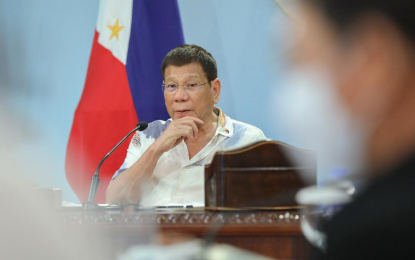 <p><strong>DRUG WAR</strong>. President Rodrigo Roa Duterte watches photos of some PHP1.482 billion worth of illegal drugs seized from recent joint operations in Quezon City, Valenzuela City, and Bulacan while presiding over a meeting with the Inter-Agency Task Force on the Emerging Infectious Diseases (IATF-EID) at the Malago Clubhouse in Malacañang Park, Manila on Aug. 2, 2021. The joint operations resulted in the arrest of four high-value drug personalities and the death of one in an armed encounter. <em>(Presidential photo by King Rodriguez)</em></p>