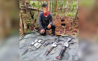 <p><strong>NPA LEADER SURRENDERS.</strong> 'Ka Arnel', a team leader and logistics officer of the NPA in Zamboanga del Norte, surrenders to government forces in Sergio Osmeña Sr. town on Tuesday (Aug. 3, 2021). He also yielded three firearms consisting of one M16 assault rifle, one M653 assault rifle and one 9mm pistol with ammunition.<em> (Photo courtesy of the 97th Infantry Battalion)</em></p>