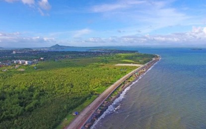 <p><strong>SHORE PROTECTION</strong>. A portion of the Leyte tide embankment project in Tacloban City in this undated photo. For passersby, the giant seawall is a perfect place for walking and feeling the sea breeze, but for residents living near the structure, it’s a protection from destructive waves brought by typhoons. <em>(Photo courtesy of Department of Public Works and Highways 8)</em></p>