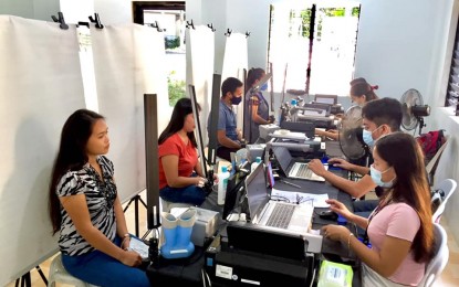 <p><strong>STEP 2.</strong> Applicants for the Philippine Identification card have their photographs taken at a registration center in Barangay Salamanca, Ginatilan, Cebu on July 26, 2021. The Step 2 process is suspended from Aug. 1 to 15 while the province is under modified enhanced community quarantine, just like in Metro Manila that has suspended registration from Aug. 6 to 20 because of the ECQ implementation. <em>(Photo courtesy of PhilSys-Ginatilan)</em></p>