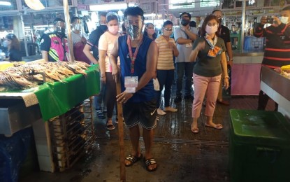 <p><strong>MARKET WATCH.</strong> Pasay City officials led by Mayor Emi Calixto-Rubiano (right) inspect the Pasay City Public Market on Friday (Aug. 6, 2021). Rubiano said they reminded businesses allowed to operate to follow health and safety protocols. <em>(Photo courtesy of Pasay-PIO)</em></p>