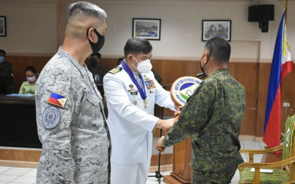 <p><strong>TURNOVER.</strong> Capt. Robeline Carpio (center) hands over the symbol of the Assistant Chief of the Unified Command Staff for Personnel to Brig. Gen. Antonio Nafarrete, Western Mindanao Command deputy commander for administration at Camp Navarro, Zamboanga City on Friday (Aug. 6, 2021). Carpio has retired and will be replaced by Navy Commander Edwin Ello (left). <em>(Photo courtesy of Westmincom-PAO)</em></p>