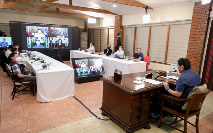 <p><strong>TALK TO THE PEOPLE</strong>. President Rodrigo Roa Duterte presides over a meeting with the Inter-Agency Task Force on the Emerging Infectious Diseases (IATF-EID) core members prior to his talk to the people at the Malago Clubhouse in Malacañang Park, Manila on Monday (Aug. 9, 2021). Duterte assured the government’s continued response against the pandemic. <em>(Presidential photo by Robinson Niñal)</em></p>