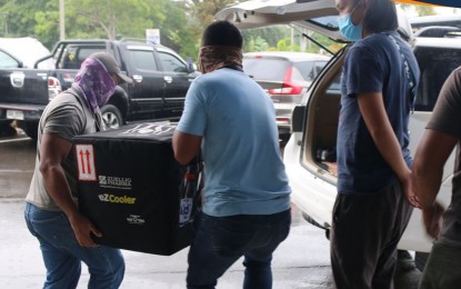<p><strong>MORE VACCINES</strong>. Workers load a box of Moderna vaccine upon its arrival at the Tacloban Airport on Monday. The Department of Health reported on Tuesday (Aug. 10, 2021) that 5,400 doses of US-made vaccines arrived in the city to boost the vaccination program. <em>(Photo courtesy of DOH Region 8)</em></p>